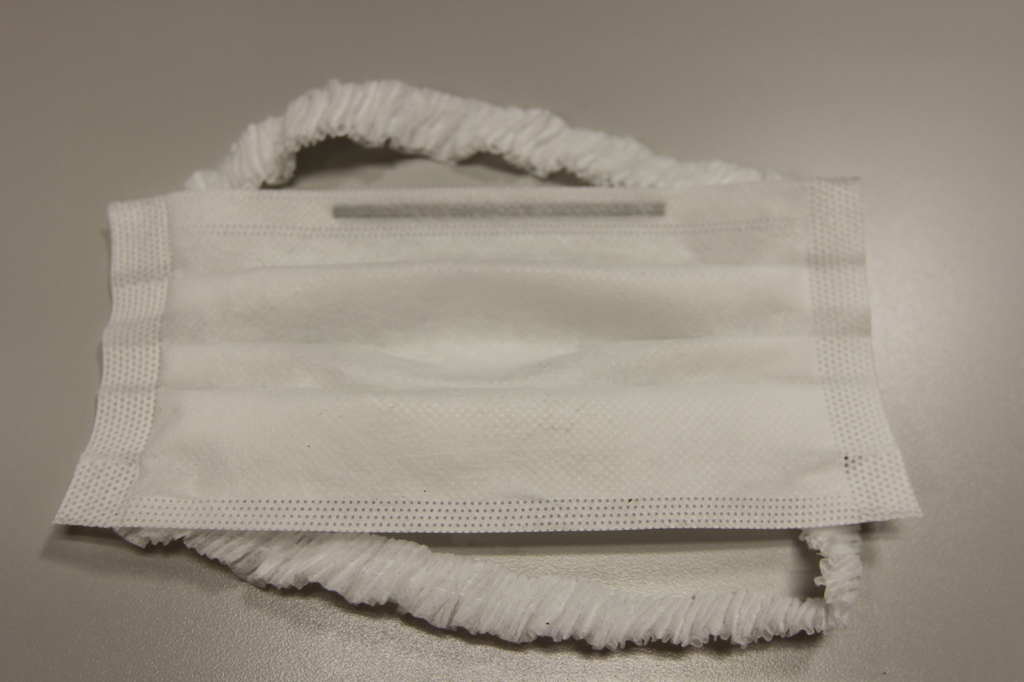 The patent-pending face mask developed by Curt G. Joa, Inc. relies on Henkel adhesives to secure the nose wire in place.