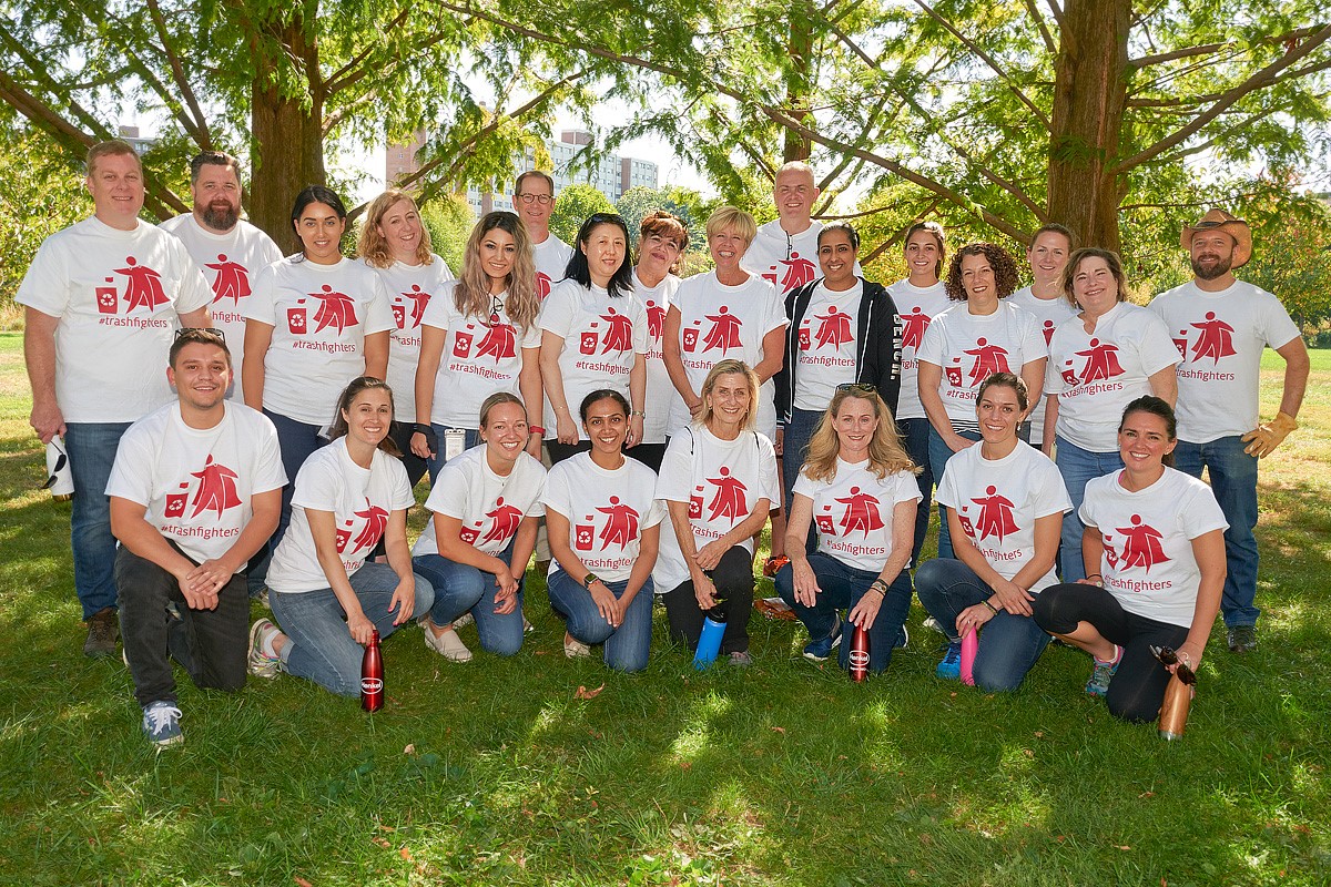 Henkel North America employees participate in #trashfighters initiative in Stamford's Mill River Park to clean up trash and raise awareness against plastic waste.