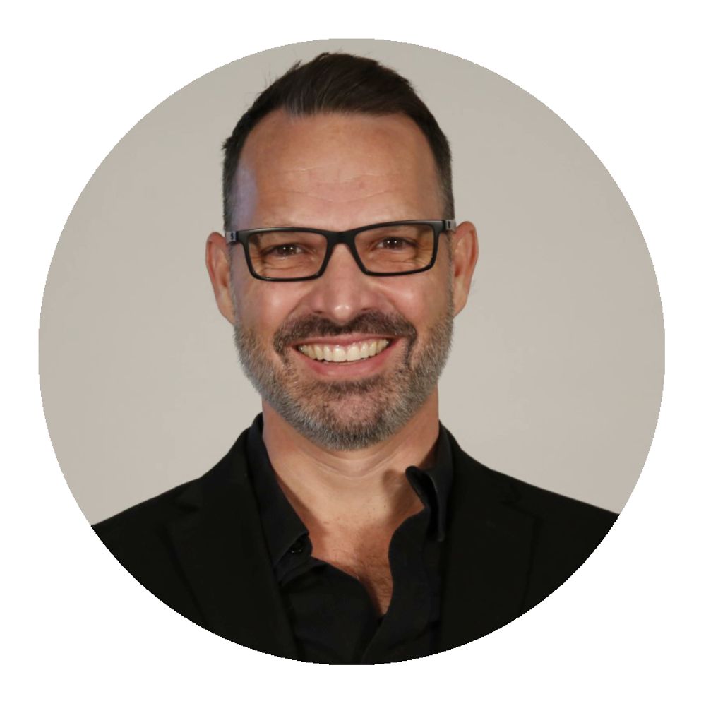 Man wearing glasses smiling at camera - Paul Wintner, Alterna Haircare Global Education Manager, Henkel Beauty