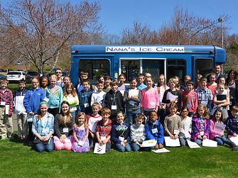Children inspected a school bus and an ice cream truck to learn where adhesives are used on the vehicles instead of rivets.