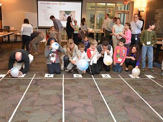 Kids and their parents raced their balloon-powered cars in the cafeteria to cap off the day.