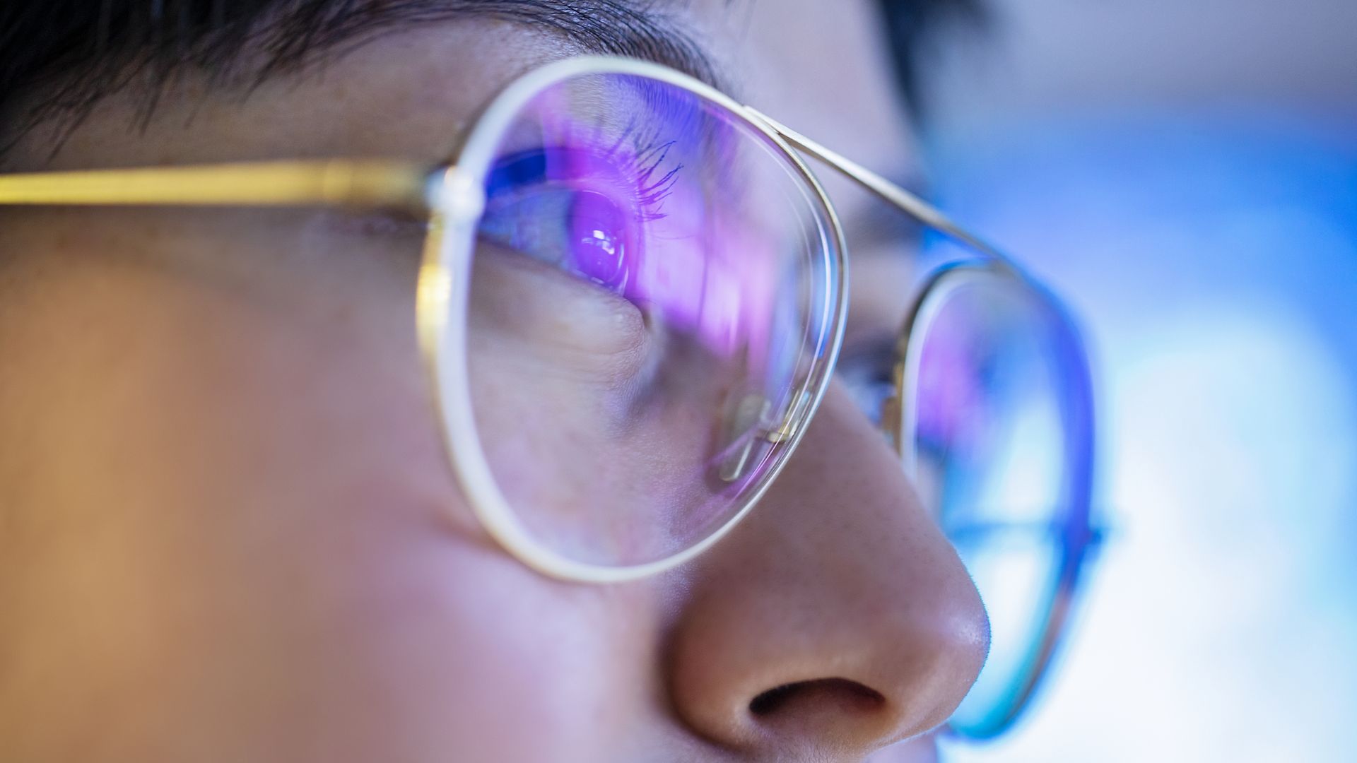 Close up of a woman with glasses.