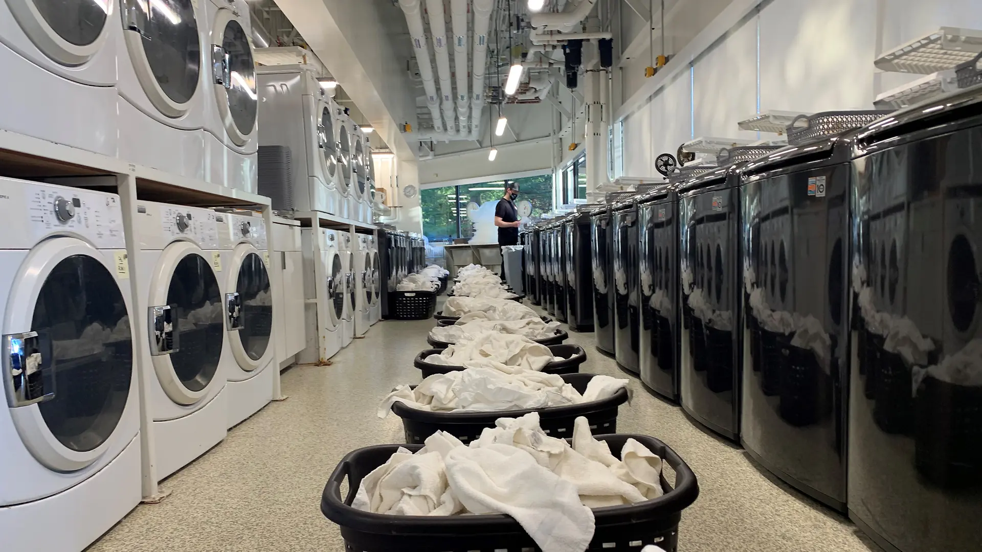 row of washing machines and dryers