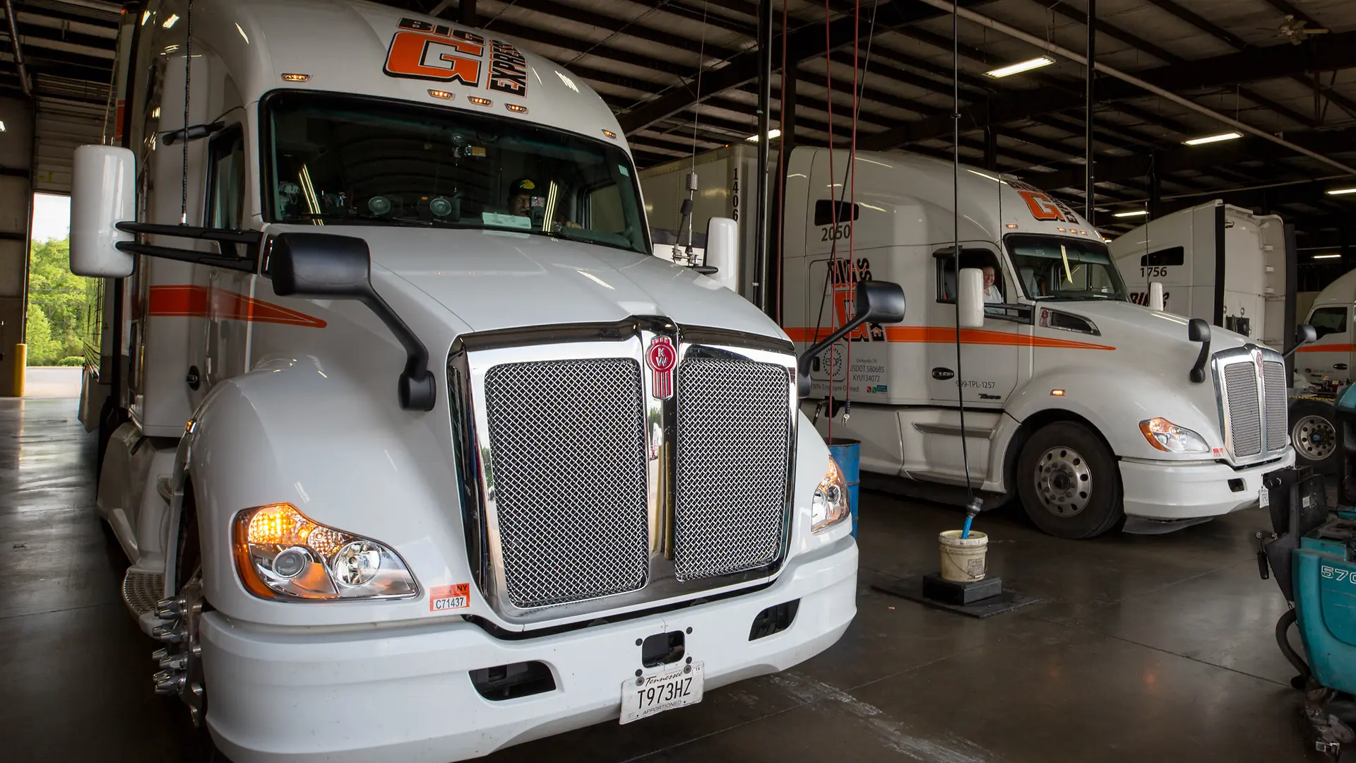 photos of various trucks and drivers smiling inside truck cab