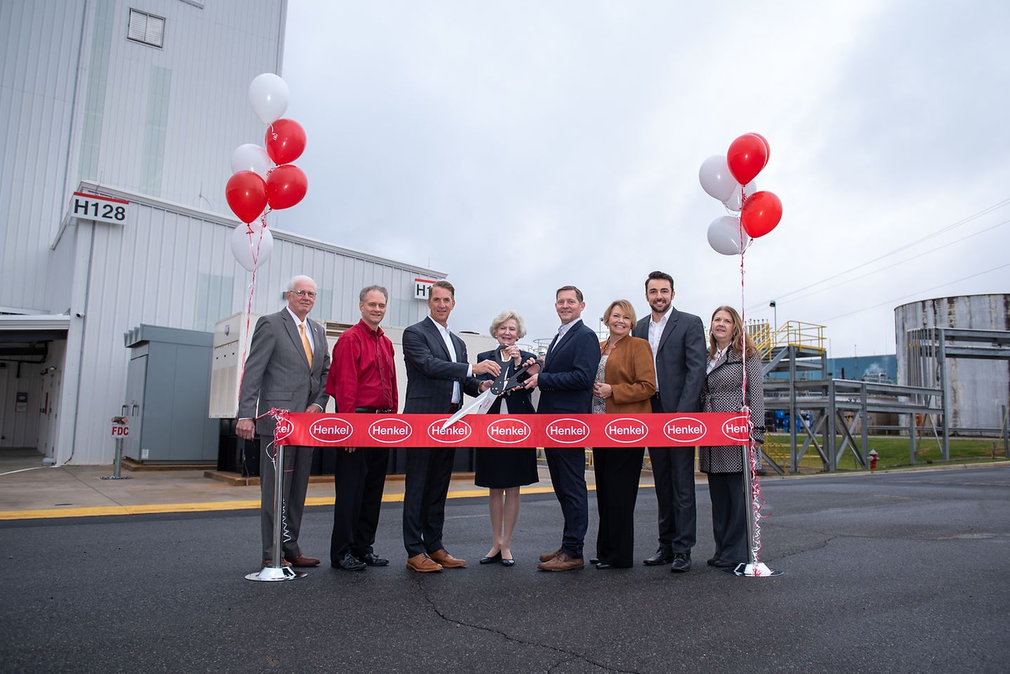 Photo of Henkel employees participating in ribbon-cutting in front of Salisbury plant