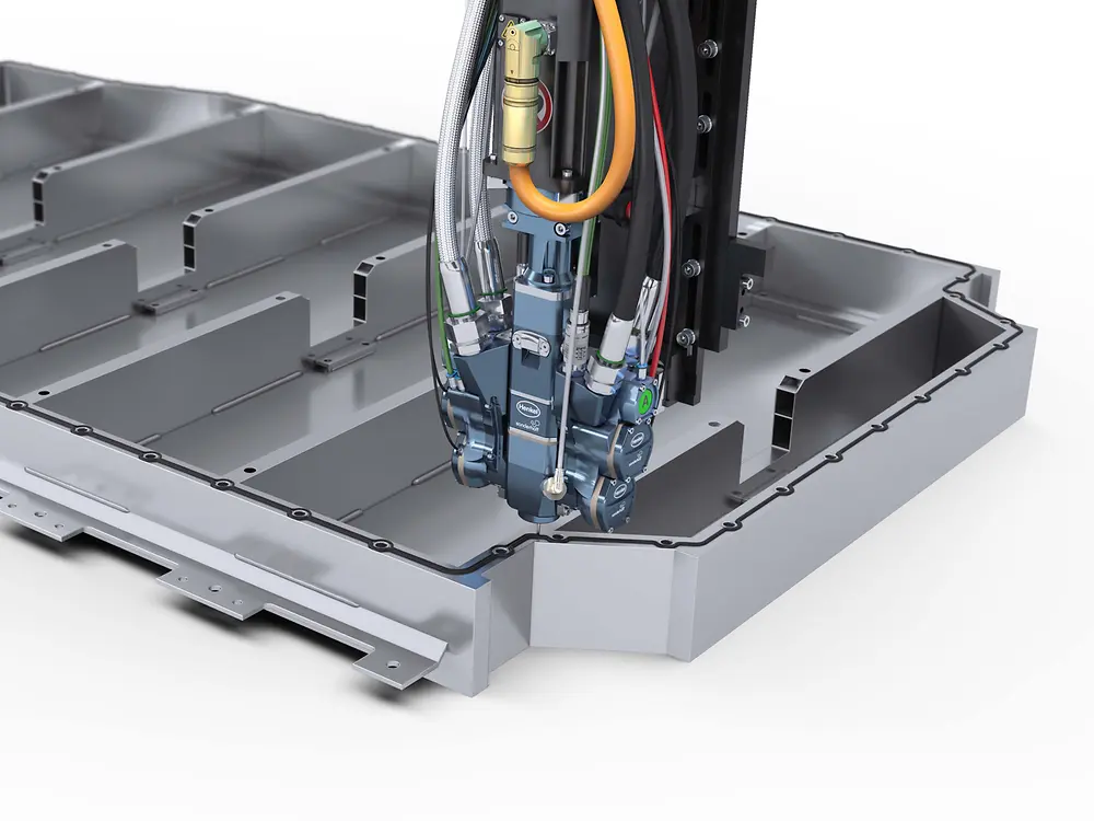 Complex machine performs precision movements on a large battery casing