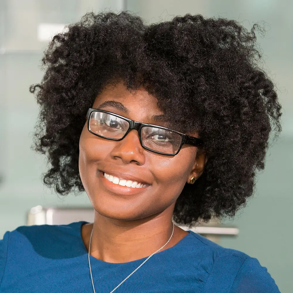 A portrait of a woman who is a Senior Vice President of Sales.