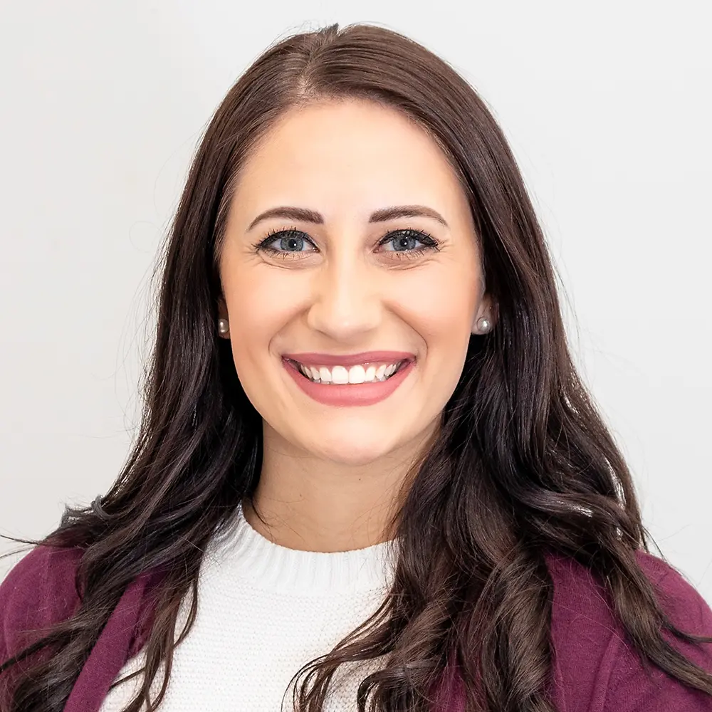 A portrait of a woman who is a E-Commerce Director.