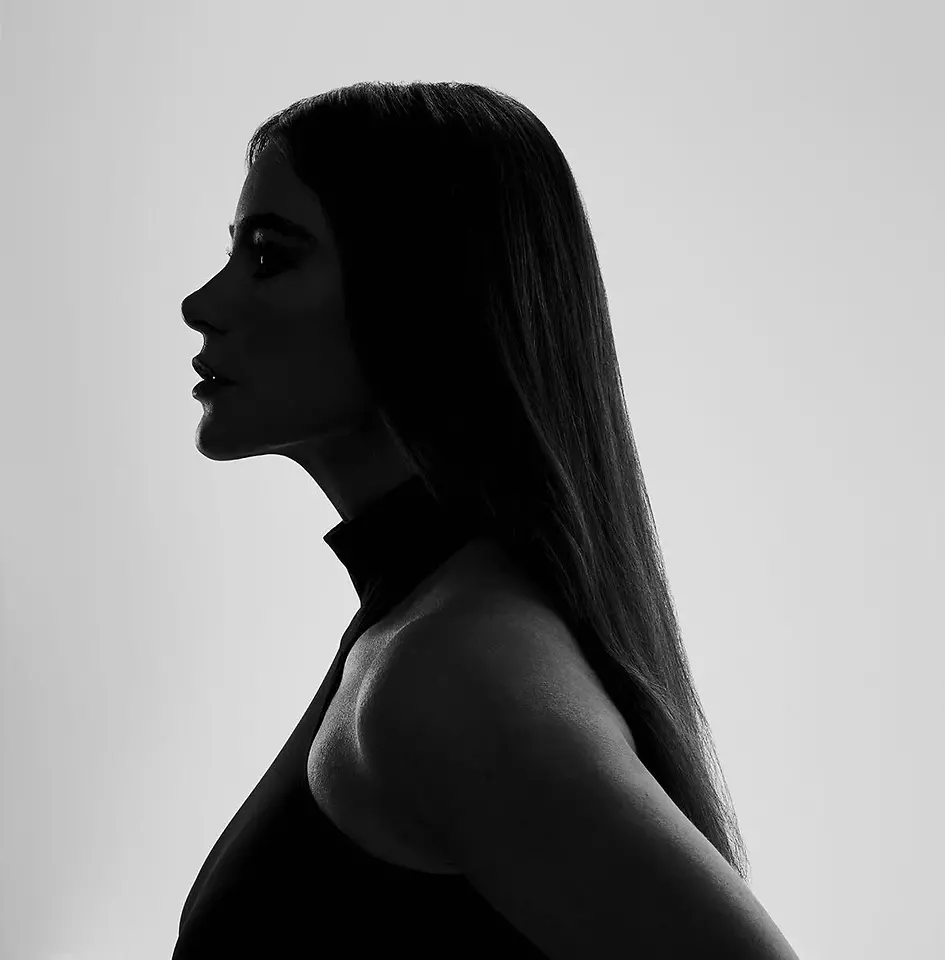 Black and white female face silhouette facing to the side