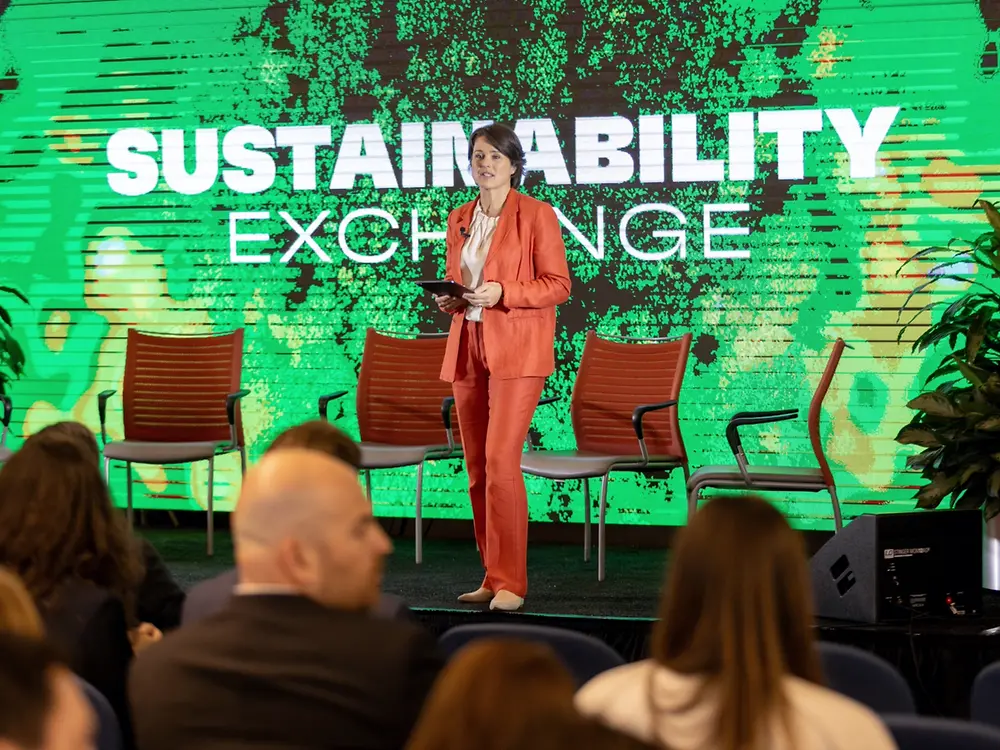 A Henkel employee presents during a sustainability-themed event.