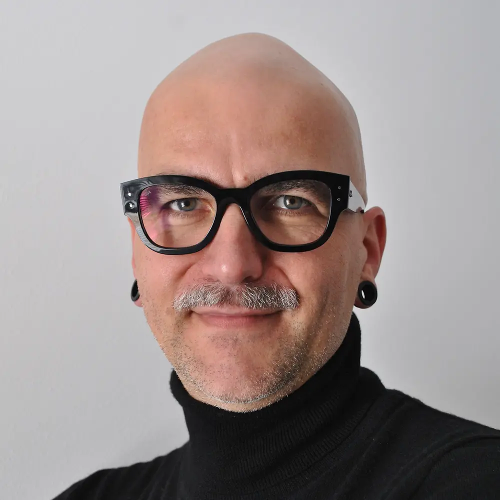 Portrait photo of Christian, showing him smiling at the camera.