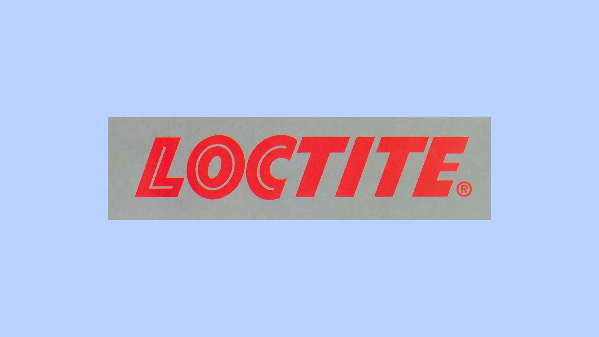 灰色背景上的紅色樂泰（Loctite）標識。 