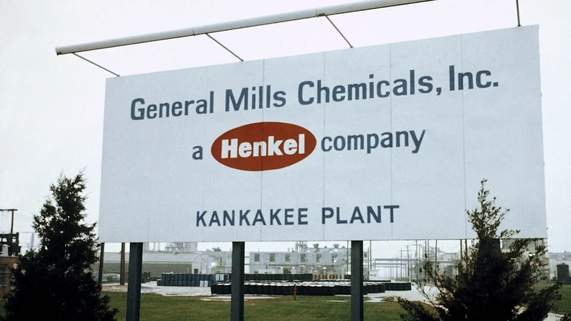 Large white sign of General Mills Chemicals and Henkel logo