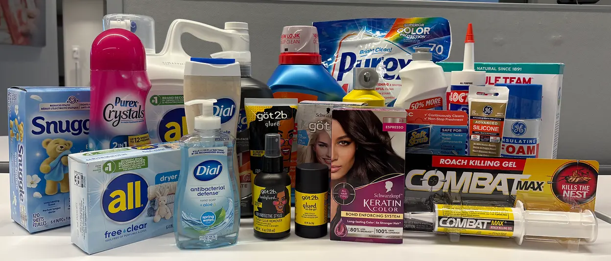 Assorted Henkel products displayed on a table.