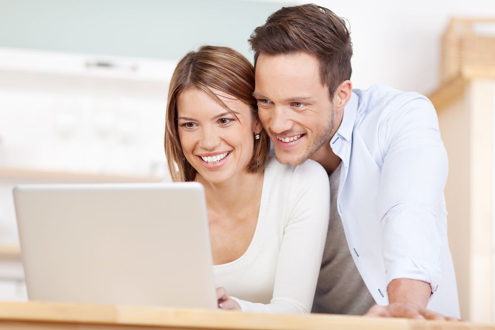 Two People in front of a PC