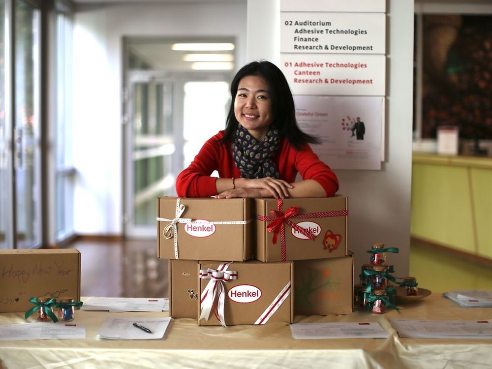 Lucy Zhang, a Grateful Green co-founder, with packed “Boxes of Love” ready to be sent to children in need all over China for the Chinese New Year.