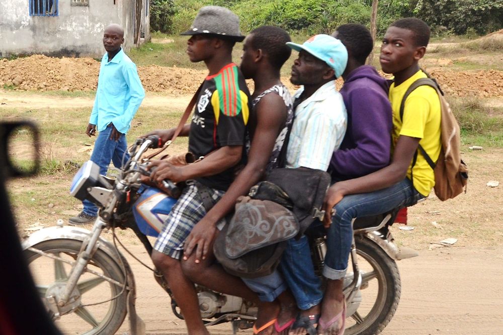 Five men on a moped.