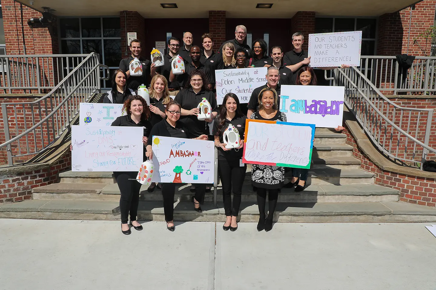 Henkel Sustainability Ambassadors from Stamford and Trumbull, Conn. in front of Stamford's Dolan Middle School following a successful afternoon of interactive sustainability education.