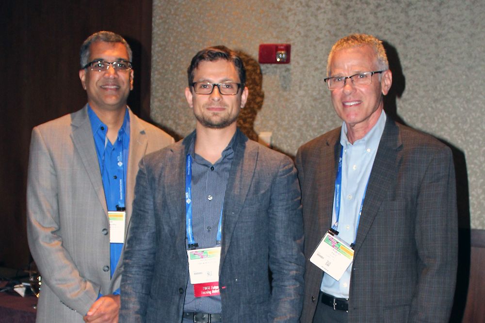 At the symposium the American Chemical Society, Coordinator of the award (left) Prof. Mahesh Mahanthappa from the University of Minnesota and Dr. Charles Paul (right), Vice President of Technology, Adhesive Technologies, join to recognize the award recipient Aleksandr V. Zhukhovitskiy from the Massachusetts Institute of Technology.