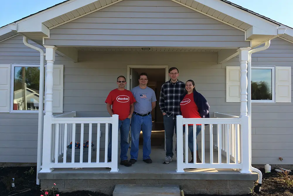 Four of the 39 team members from Henkel’s Bowling Green facility who worked over the course of two days to finish this Habitat for Humanity® home.