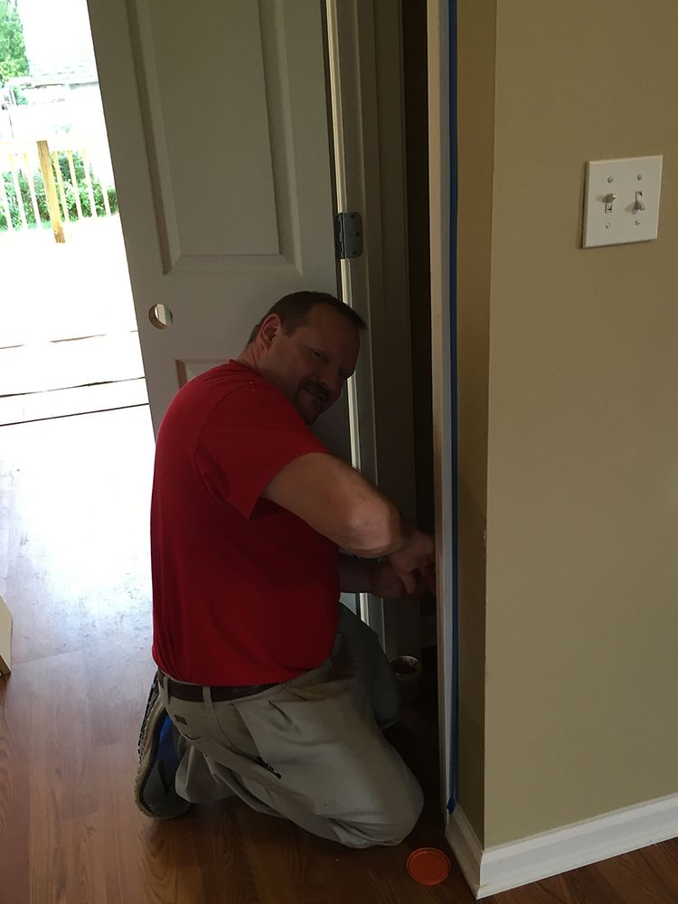 A Henkel employee puts the finishing touches on a closet for the Habitat for Humanity® home.