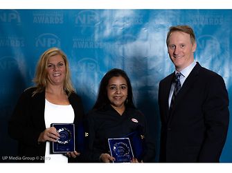 (From L to R) Henkel’s Chris Maksud, Regional Sales Director Automotive Electronics, and Rita Mohanty, Director of Technical Customer Service,Thermal, accept NPI Awards from Circuits Assembly magazine Editor-in-Chief, Mike Buetow.