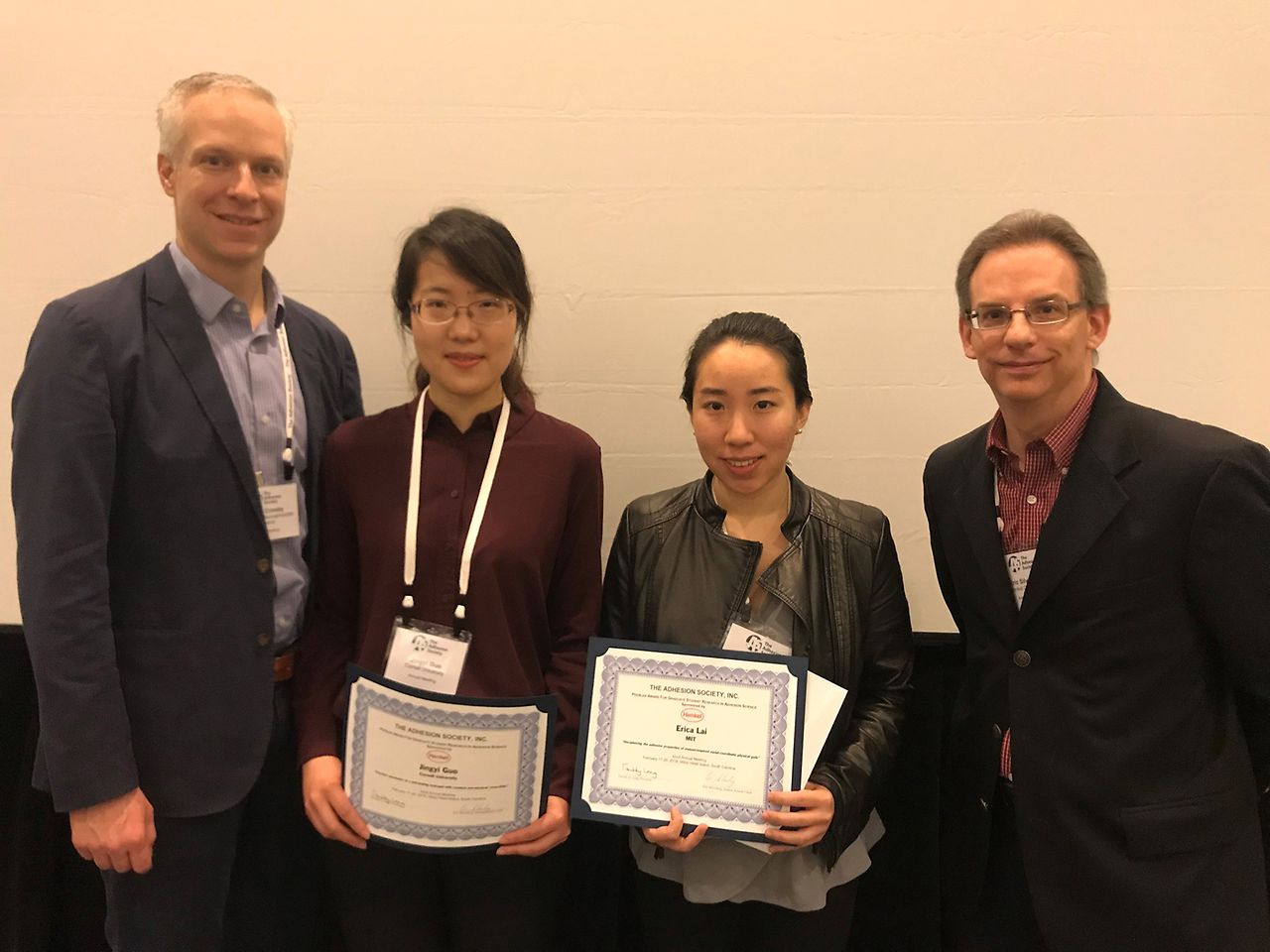 Professor Al Crosby (left) and Henkel’s Eric Silverberg presented the awards at the annual meeting of the Adhesion Society to (L to R) Jingyi Guo and Erika Lai.