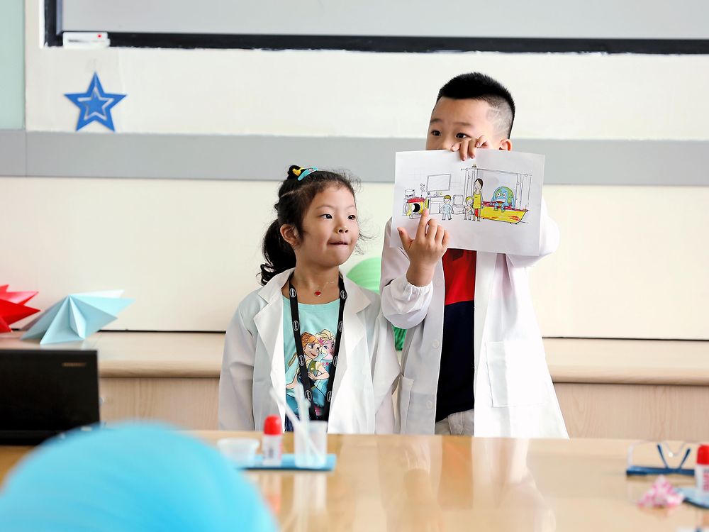 
Learning by playing - elementary school children are taught how to handle our planet's resources responsibly. An Xintong and Gan Jiayu are proud of what they've learned at a holiday school in Shanghai, China.