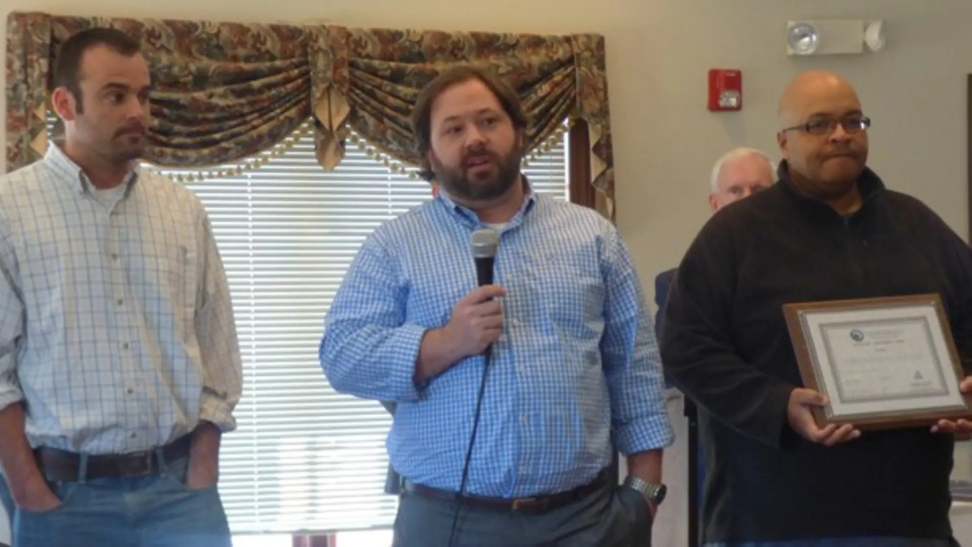 Henkel employees (left to right) Mike Delaney, Trent Mason and Antoine Ryan accept a certificate recognizing the important role the Lincolnton facility has played in the community for the past decade. Dwarfed by neighbouring facilities in the industrial park, Lincolnton is the “little plant that could,” says Plant Manager Trent Mason.